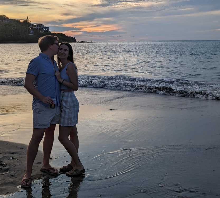 madi and logan on a beach